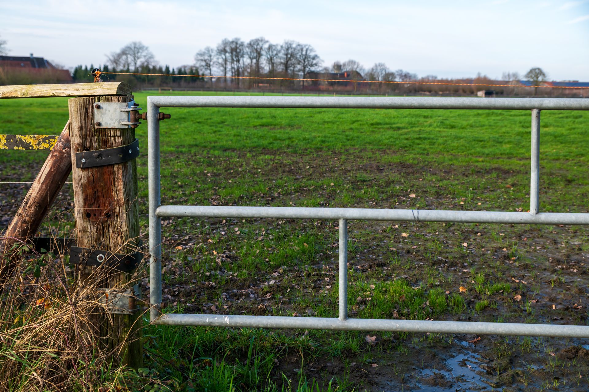 Farm gate and electric fence securing a rural property